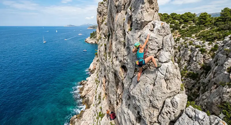 Rock climbing on limestone cliffs above the sea